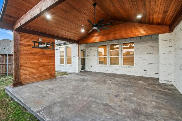 a view of an empty room with windows