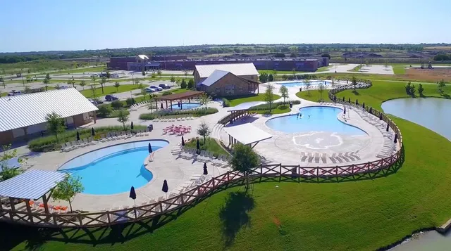 an aerial view of a house with outdoor space swimming pool and outdoor seating