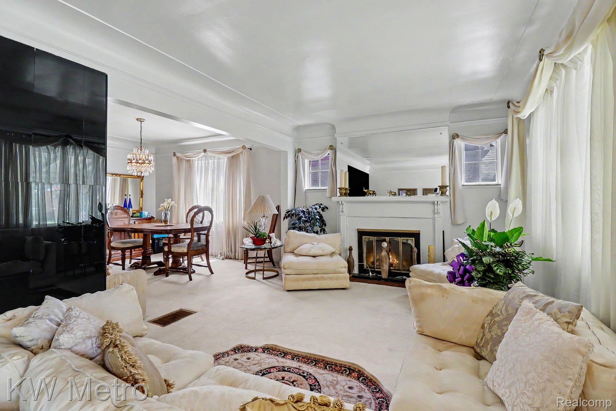 9116 Meyers Road Detroit, MI 48228 - Photo 4 of 17 Carpeted living room with a fireplace