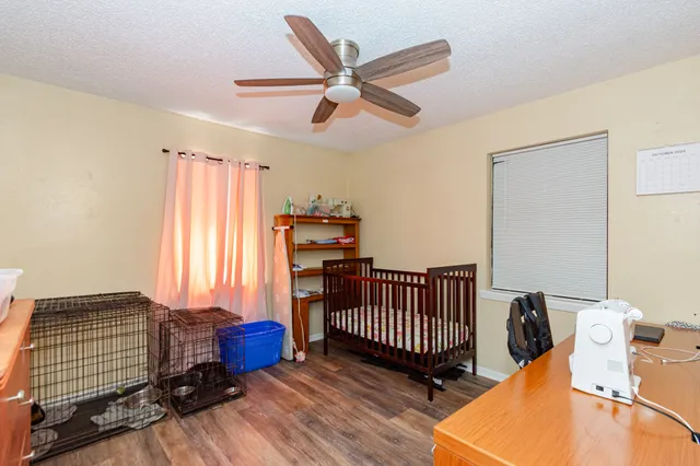a bedroom with furniture and a window