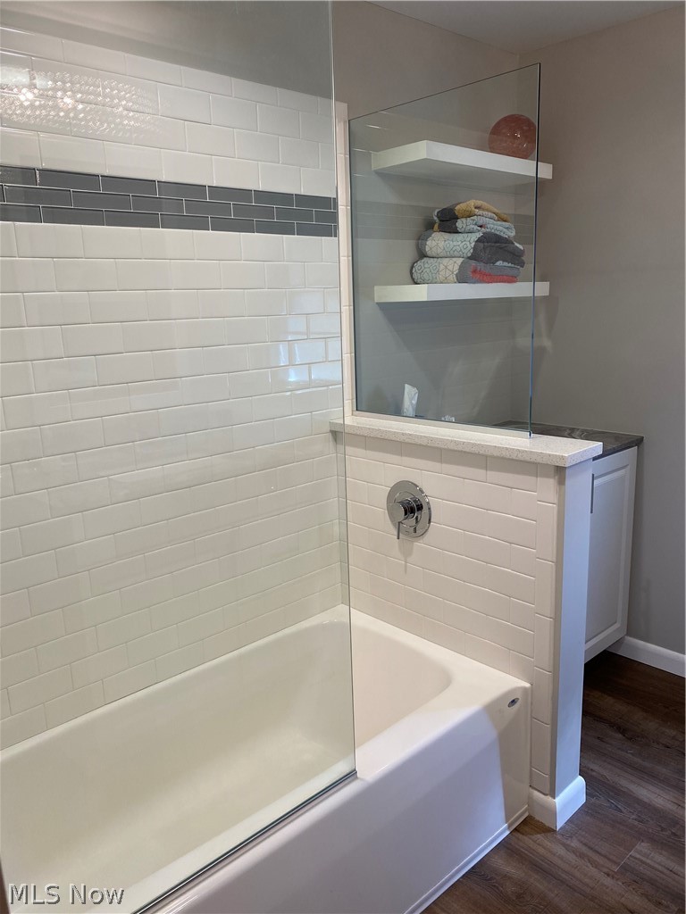 14549 Cedar Road Cleveland, OH 44121 - Photo 13 of 23 Upstairs - Bathroom with tiled shower / bath combo and hardwood / wood-style floors