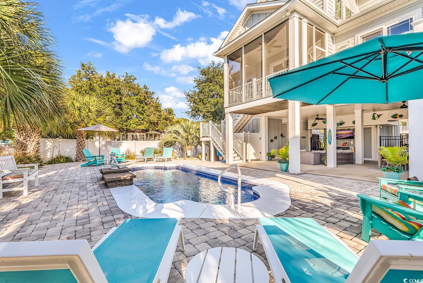 519 1st Street Murrells Inlet, SC 29576 - Photo 3 of 40 View of swimming pool with a sunroom, a patio area