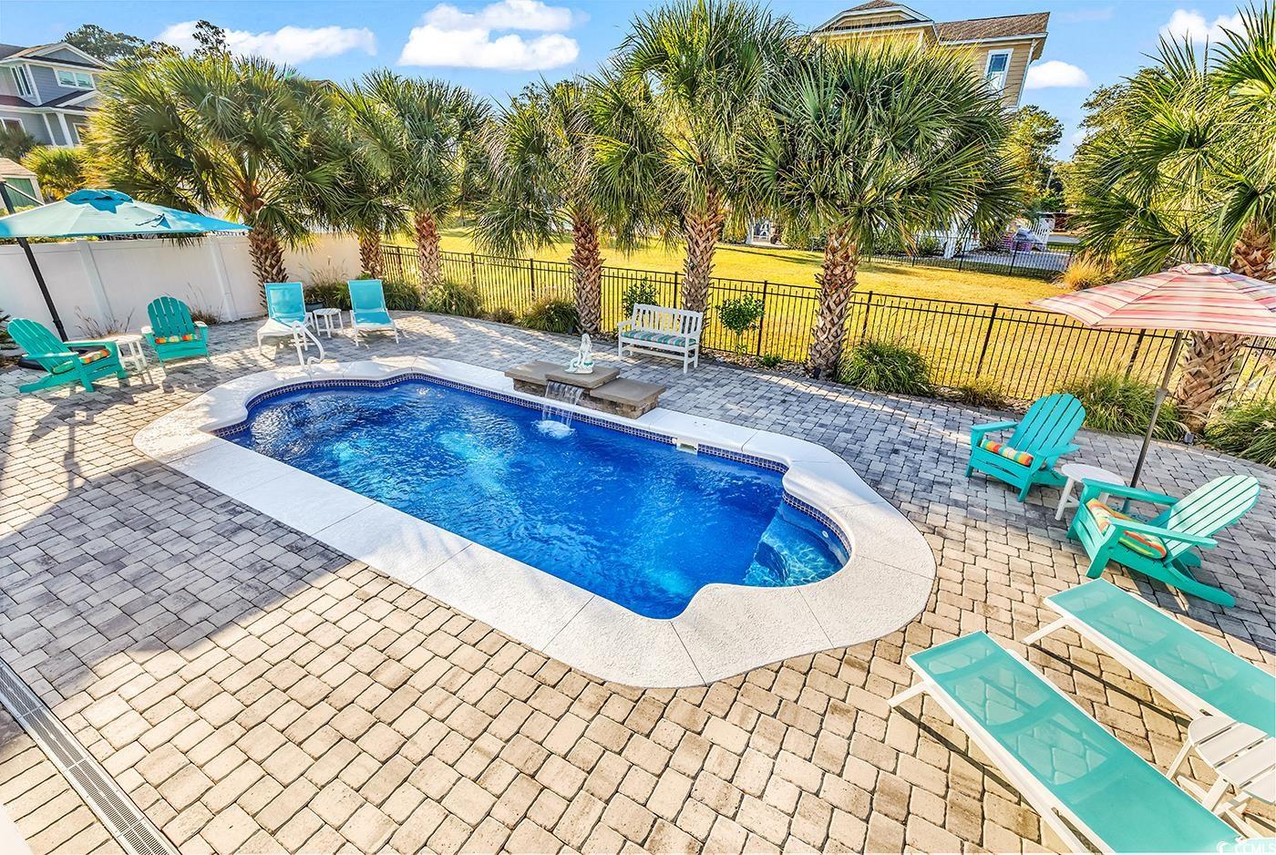 519 1st Street Murrells Inlet, SC 29576 - Photo 8 of 40 View of pool with a yard, a jacuzzi, and a patio