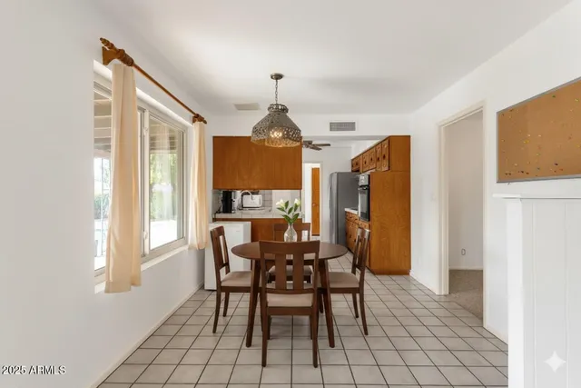 a kitchen with stainless steel appliances granite countertop a refrigerator and cabinets