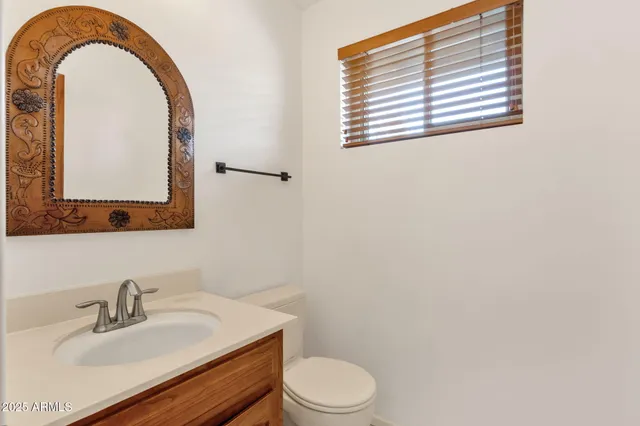 a room with a sink and a mirror