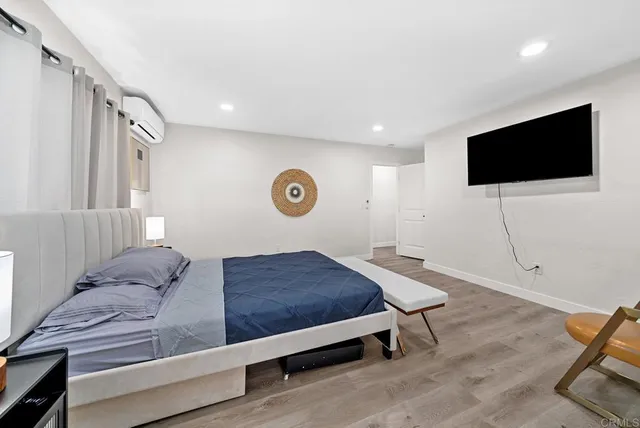 a spacious bathroom with a sink toilet a mirror and shower