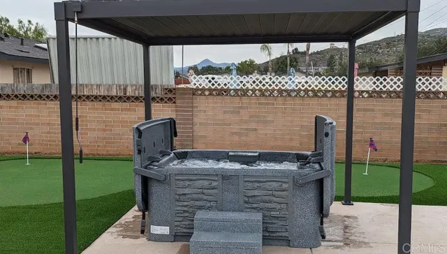 a view of a patio with table and chairs potted plants with wooden floor