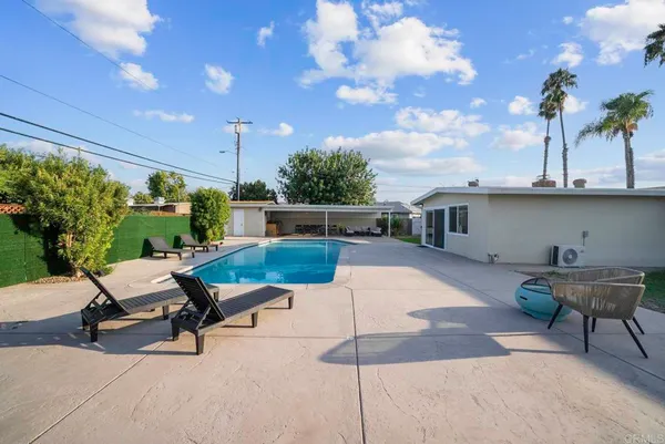 a view of a swimming pool with a patio