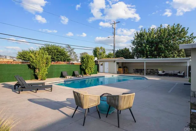 a view of a swimming pool with a patio