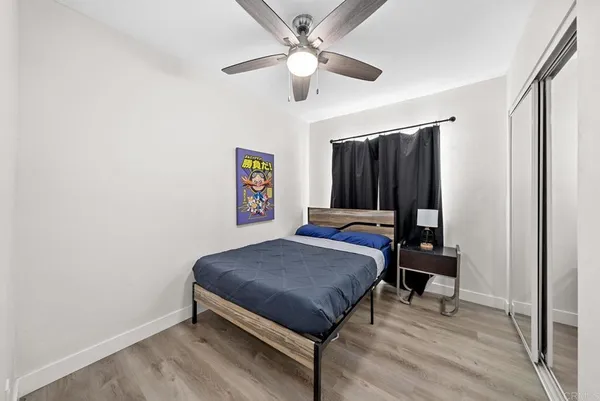 a bed room with a bed and a chandelier