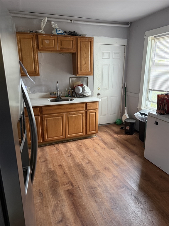 8 Ogden Street Boston, MA 02124 - Photo 6 of 20 a room with a sink and a bed