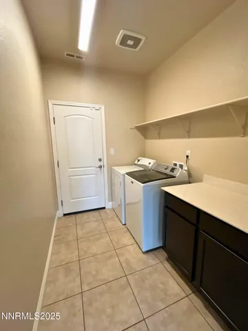 a kitchen with a sink a stove and cabinets