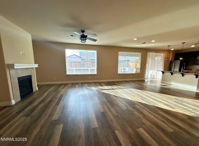 wooden floor in an empty room with a fireplace