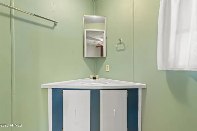 a view of a big room with closet and a chandelier fan