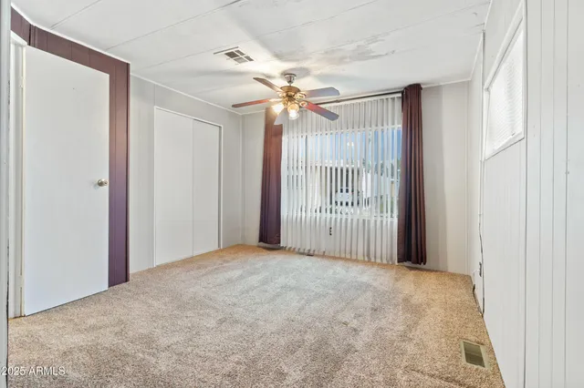 a kitchen with cabinets and stainless steel appliances