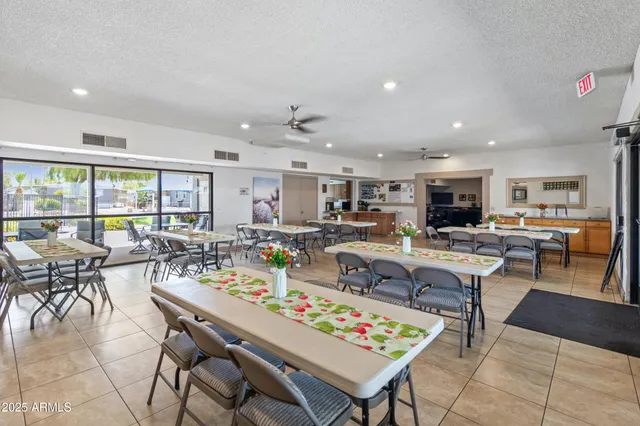 a kitchen with stainless steel appliances granite countertop a sink counter space cabinets and a stove