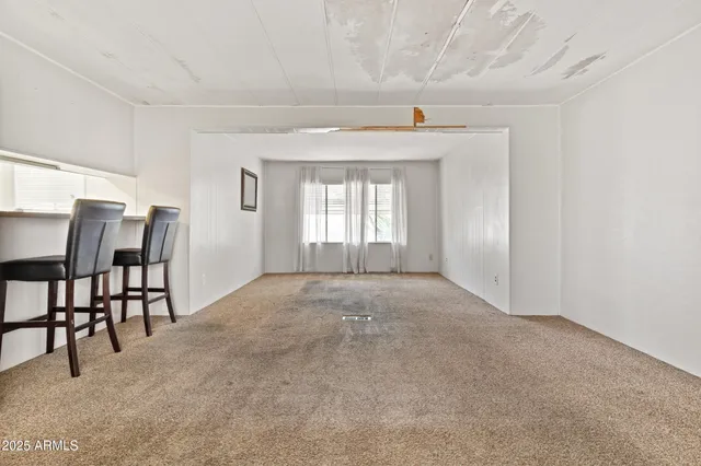 a view of livingroom with furniture and window