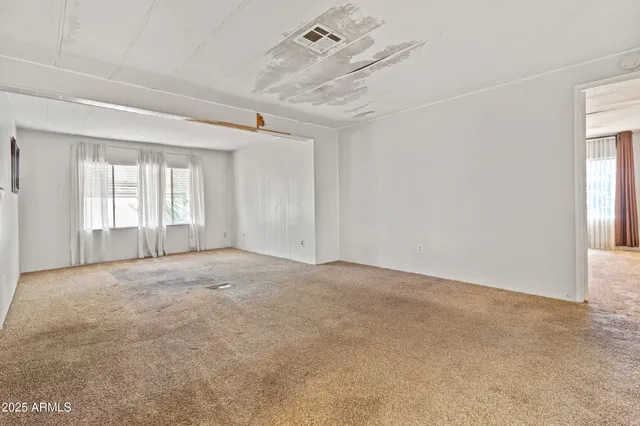 an empty room with windows