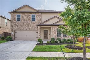 700 Mallow Road Leander, TX 78641 - Photo 1 of 28 An inviting stone and stucco exterior features a manicured front lawn and a double garage.