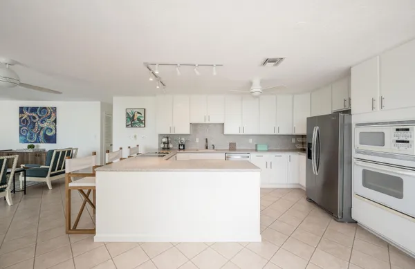 a kitchen with a sink a counter top space and appliances