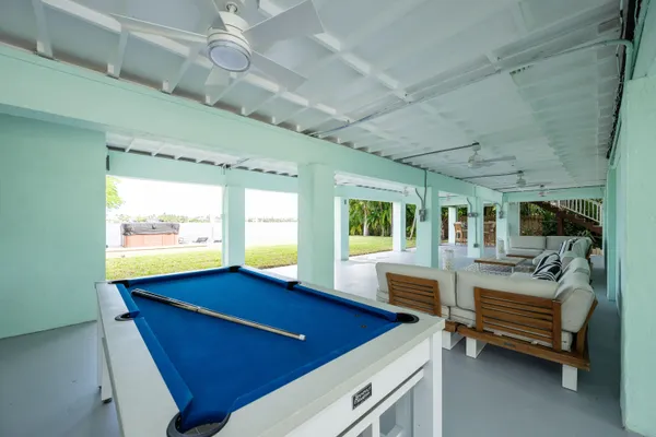 a balcony with furniture and wooden floor