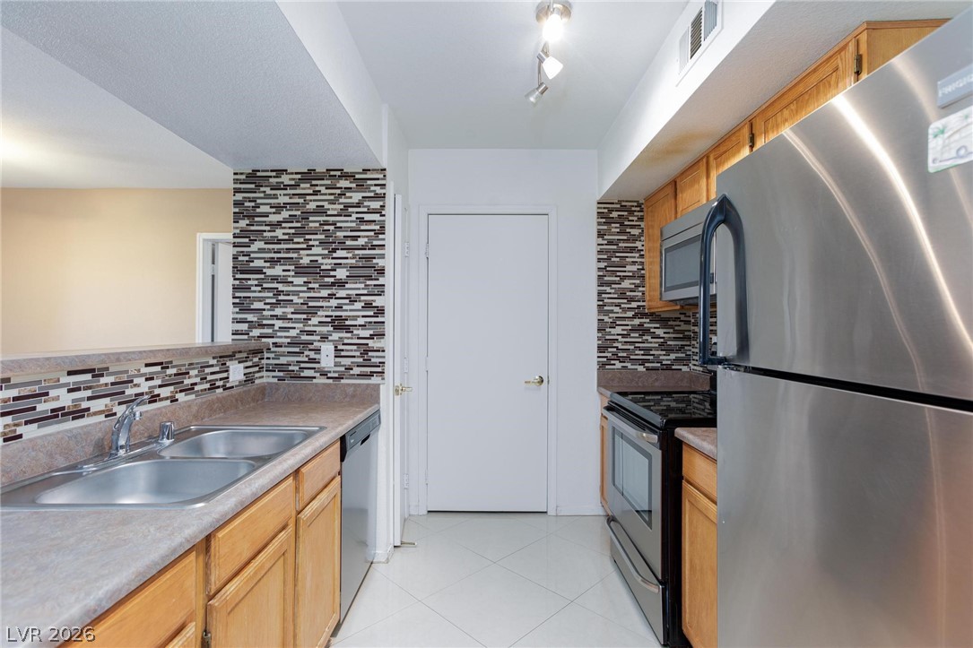 6650 West Warm Springs Road, Unit 2027 Las Vegas, NV 89118 - Photo 11 of 29 This modern kitchen features sleek stainless steel appliances and ample counter space for culinary endeavors.