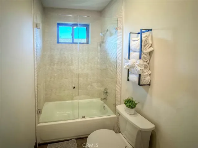 a bathroom with a toilet sink and bathtub
