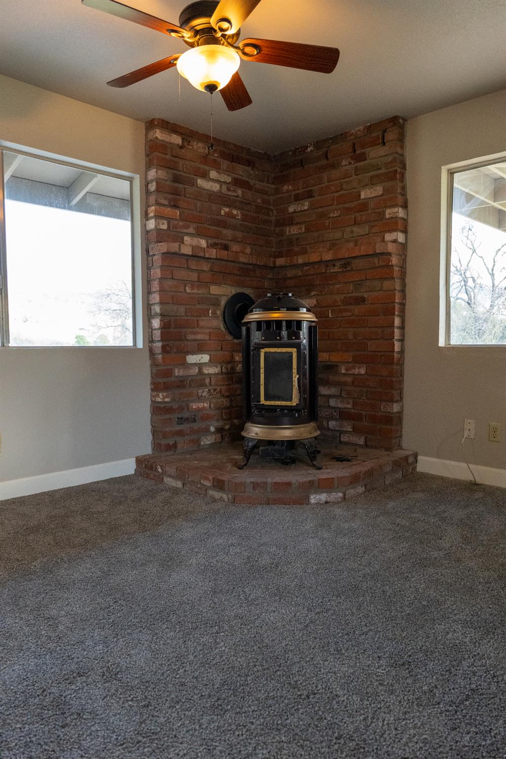 42560 Ranger Cir Way Coarsegold, CA 93614 - Photo 19 of 44 a view of an empty room with a fireplace