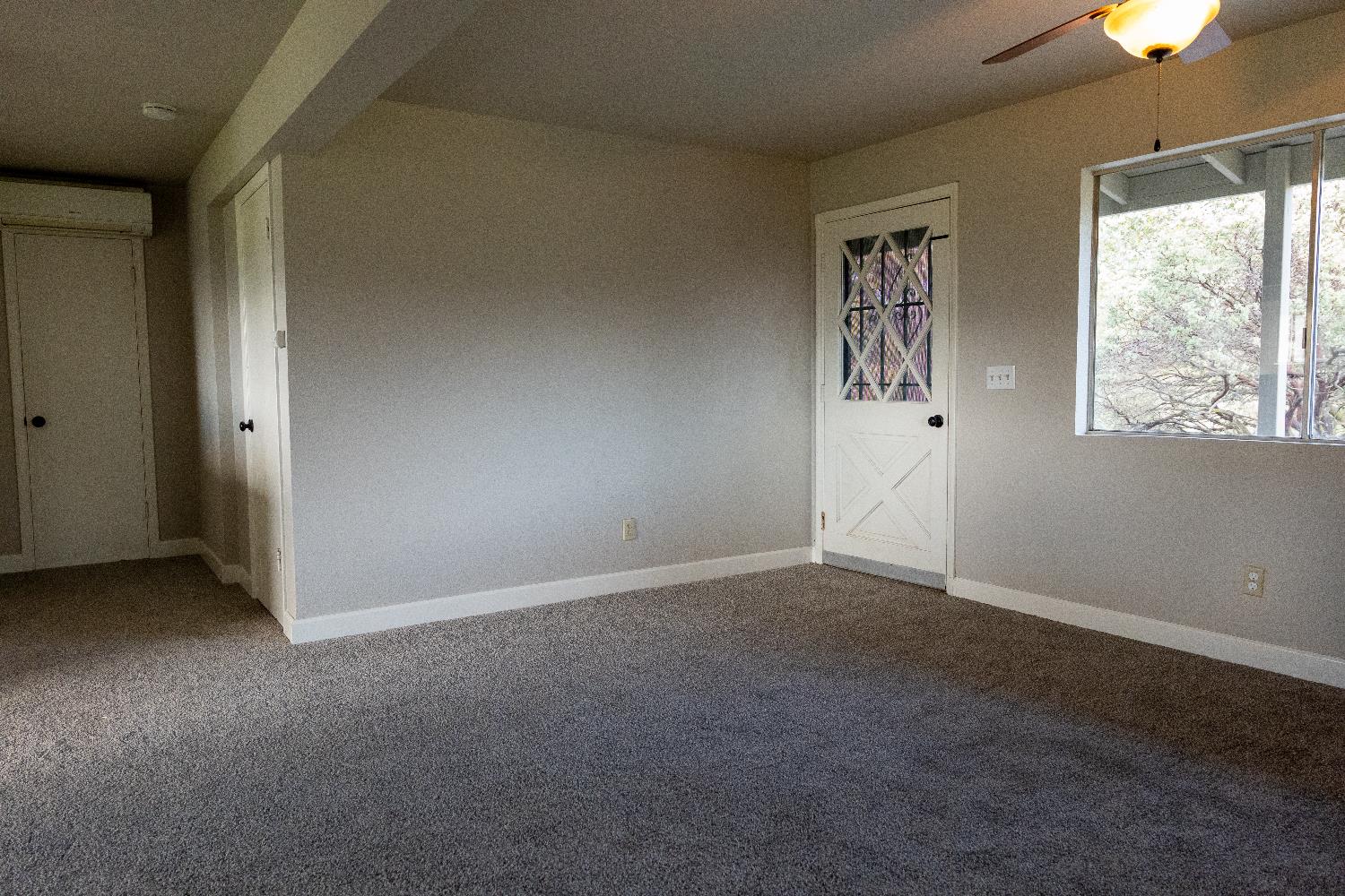 42560 Ranger Cir Way Coarsegold, CA 93614 - Photo 22 of 44 an empty room with windows and closet