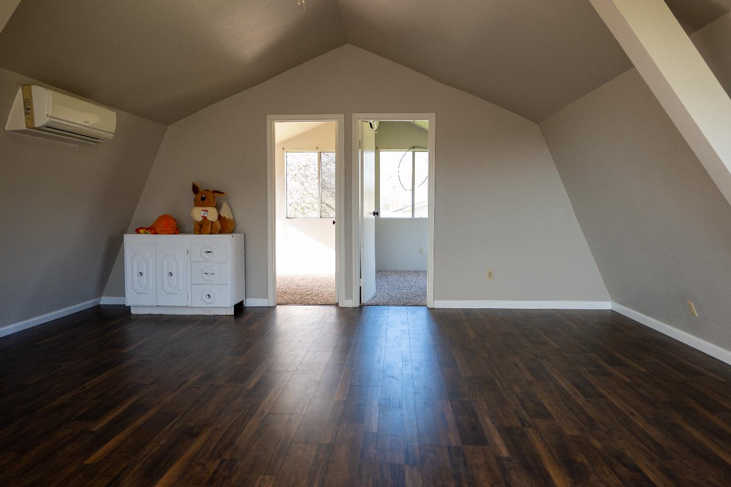 42560 Ranger Cir Way Coarsegold, CA 93614 - Photo 30 of 44 an empty room with wooden floor and windows