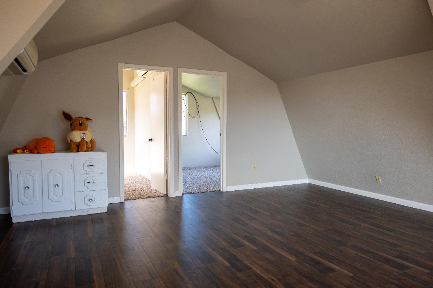 42560 Ranger Cir Way Coarsegold, CA 93614 - Photo 31 of 44 a view of an empty room with wooden floor and a cabinet