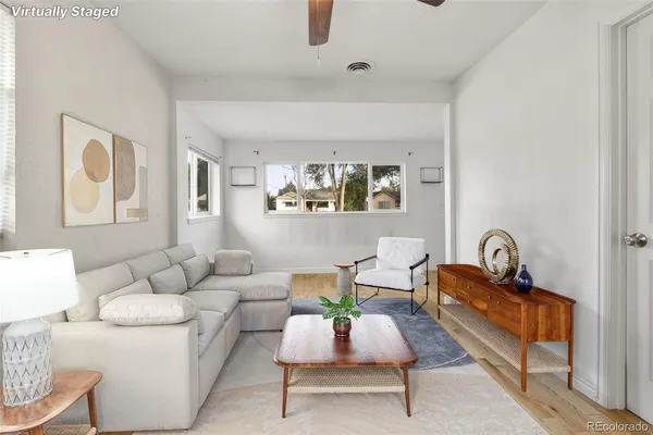 a living room with furniture and window
