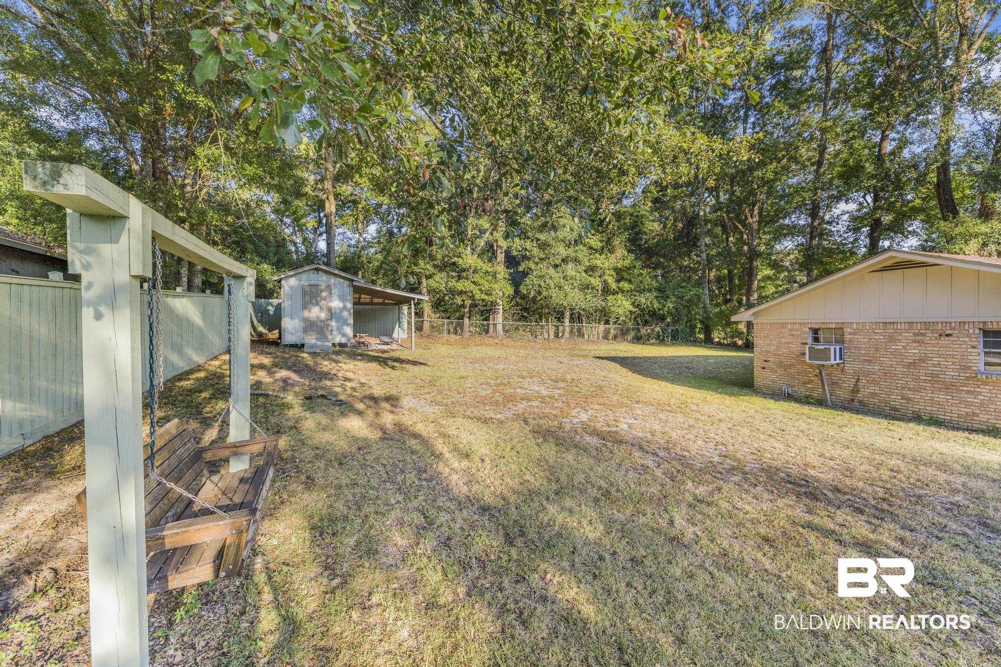 2573 E Road Mobile, AL 36693 - Photo 32 of 45 View of yard featuring an outbuilding