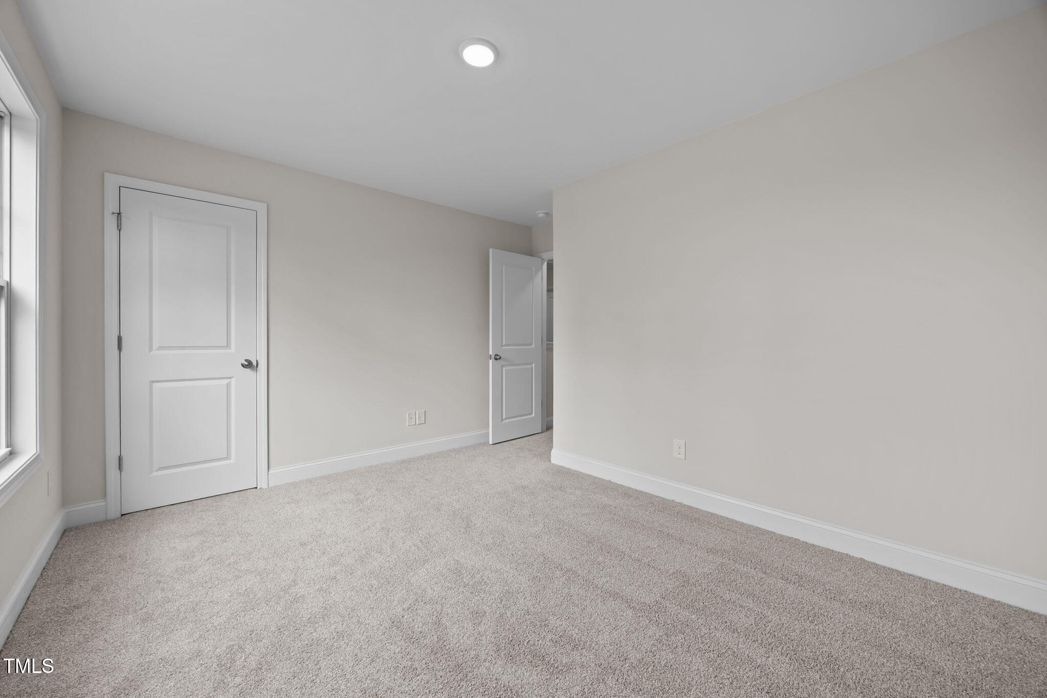 187 Regis Lane, Unit 10 Coats, NC 27521 - Photo 18 of 38 a view of an empty room and window