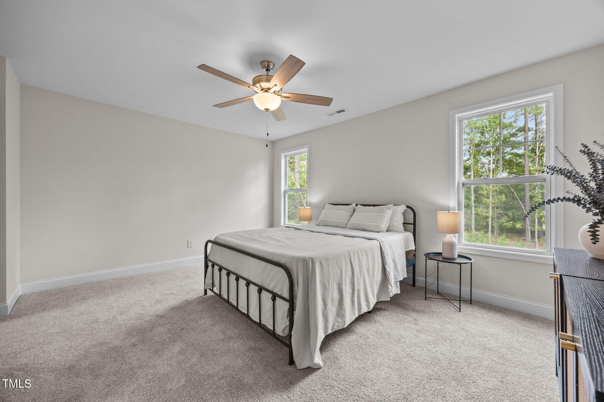 187 Regis Lane, Unit 10 Coats, NC 27521 - Photo 20 of 38 a bedroom with a bed and a window