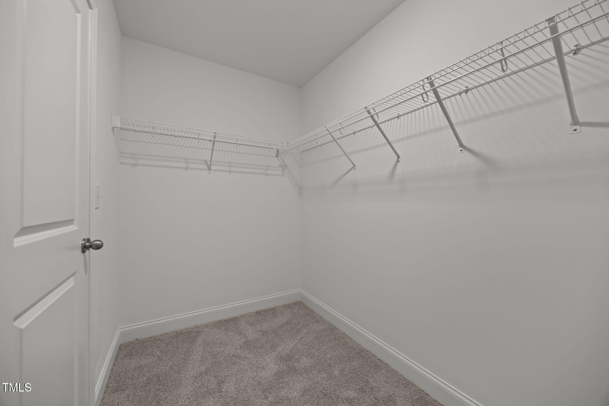 187 Regis Lane, Unit 10 Coats, NC 27521 - Photo 24 of 38 a view of a room with racks on the wall