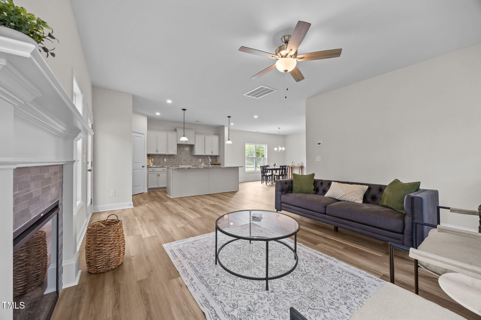 187 Regis Lane, Unit 10 Coats, NC 27521 - Photo 3 of 38 a living room with furniture and kitchen view
