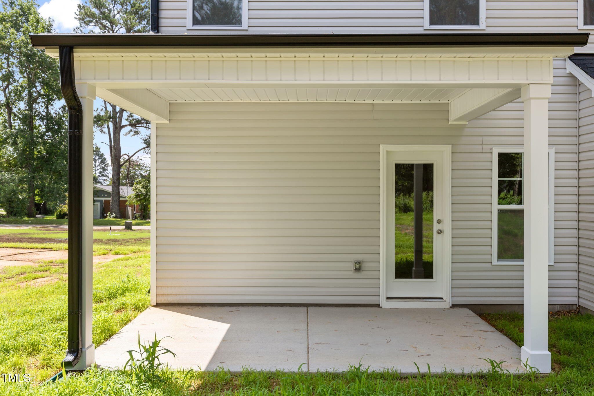 187 Regis Lane, Unit 10 Coats, NC 27521 - Photo 37 of 38 a view of front door of house with a yard