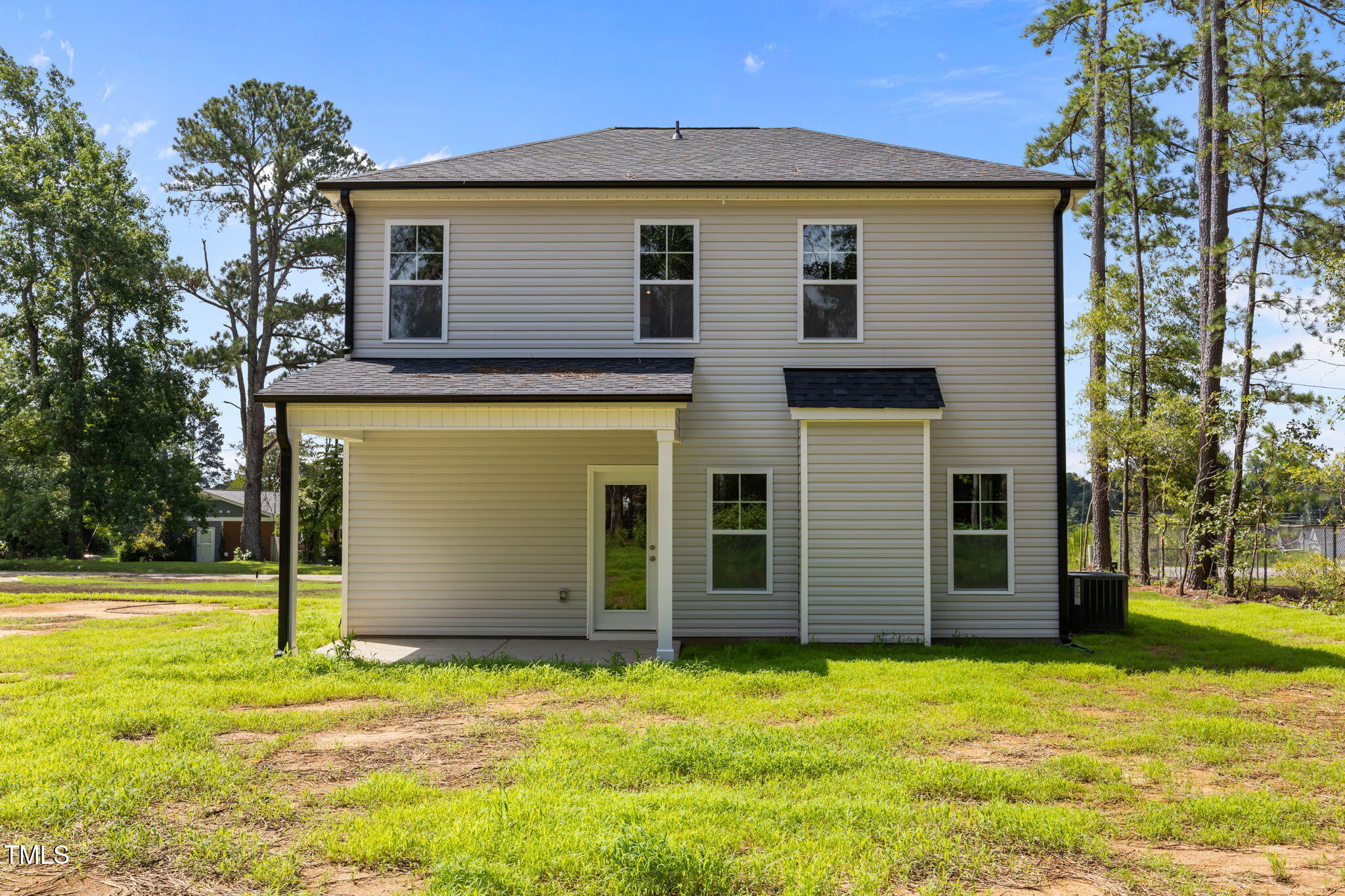 187 Regis Lane, Unit 10 Coats, NC 27521 - Photo 38 of 38 a front view of a house with a yard