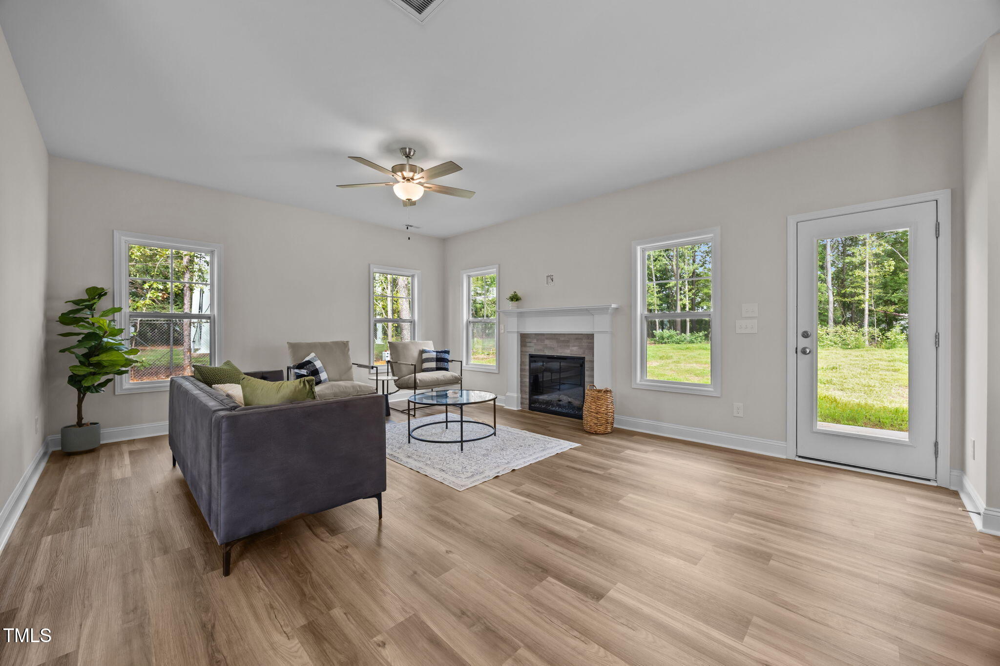 187 Regis Lane, Unit 10 Coats, NC 27521 - Photo 4 of 38 a living room with furniture and a fireplace