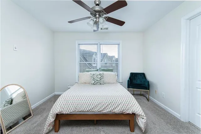 a bedroom with a bed and window