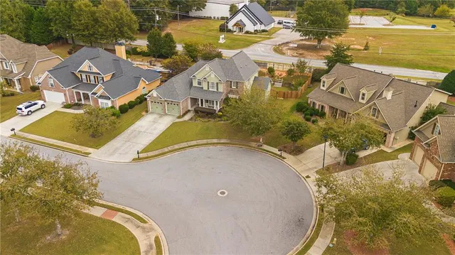 an aerial view of a house with a swimming pool