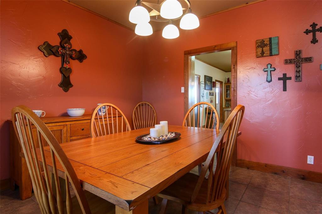 7158 Luella Road Sherman, TX 75090 - Photo 17 of 40 a view of a dining room with furniture and wooden floor