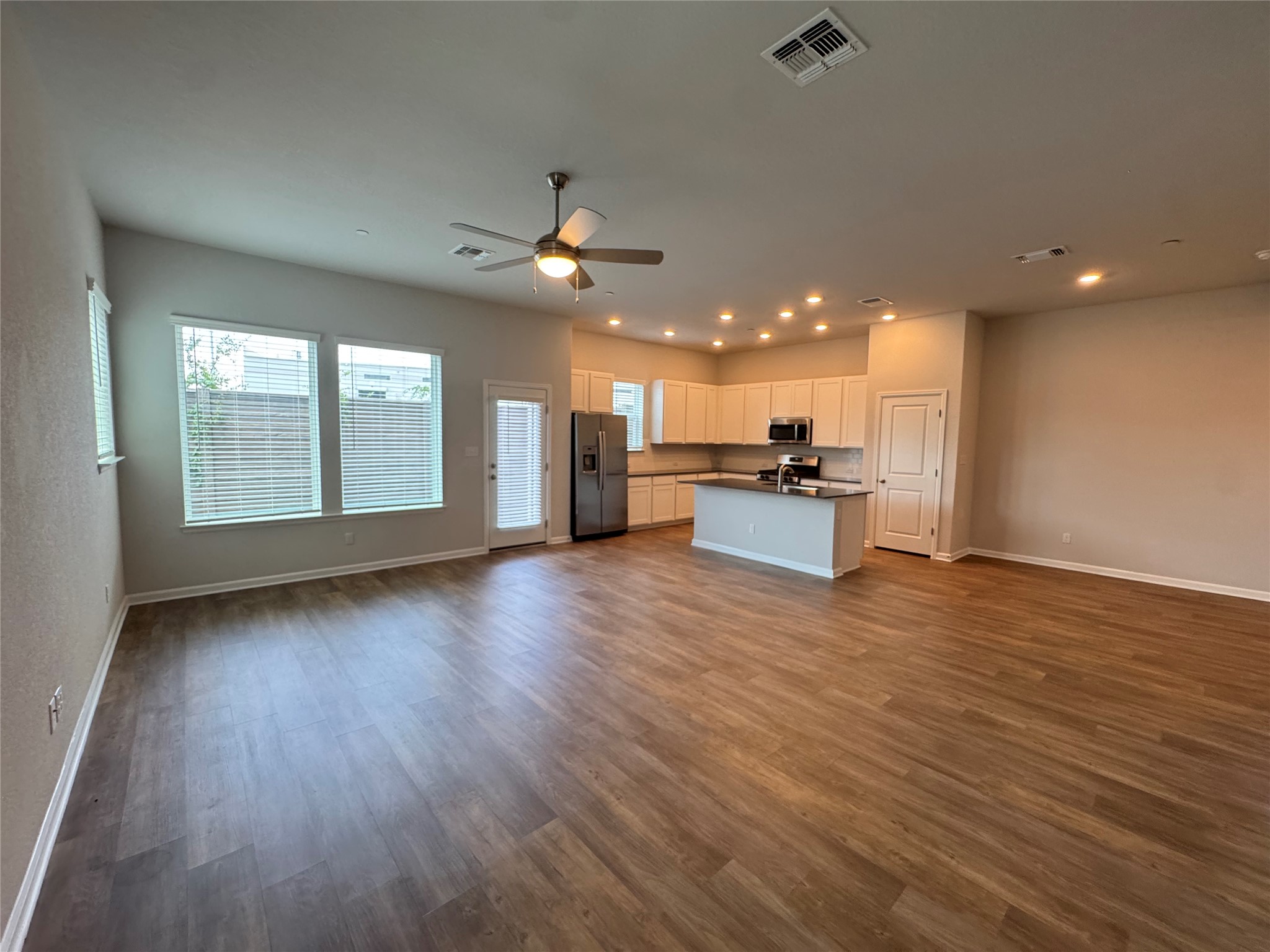 3000 Chisholm Trail Road, Unit 41 Round Rock, TX 78681 - Photo 6 of 28 An open concept living area features ample natural light and a modern kitchen.