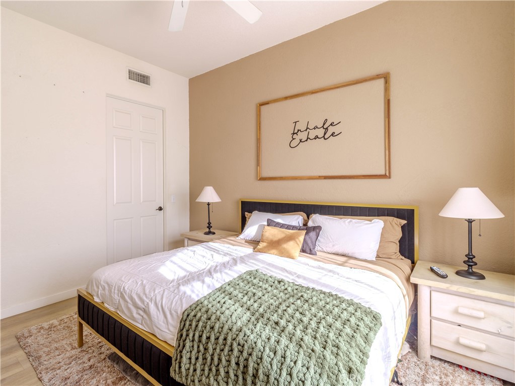 50680 Santa Rosa Plaza, Unit 8 La Quinta, CA 92253 - Photo 14 of 20 a bedroom with a bed and a lamp on dresser