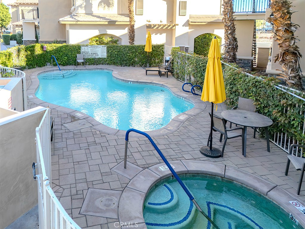 50680 Santa Rosa Plaza, Unit 8 La Quinta, CA 92253 - Photo 17 of 20 a view of a swimming pool with a patio and plants