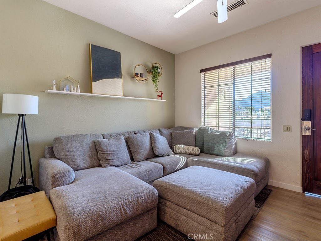 50680 Santa Rosa Plaza, Unit 8 La Quinta, CA 92253 - Photo 3 of 20 a living room with furniture and a window