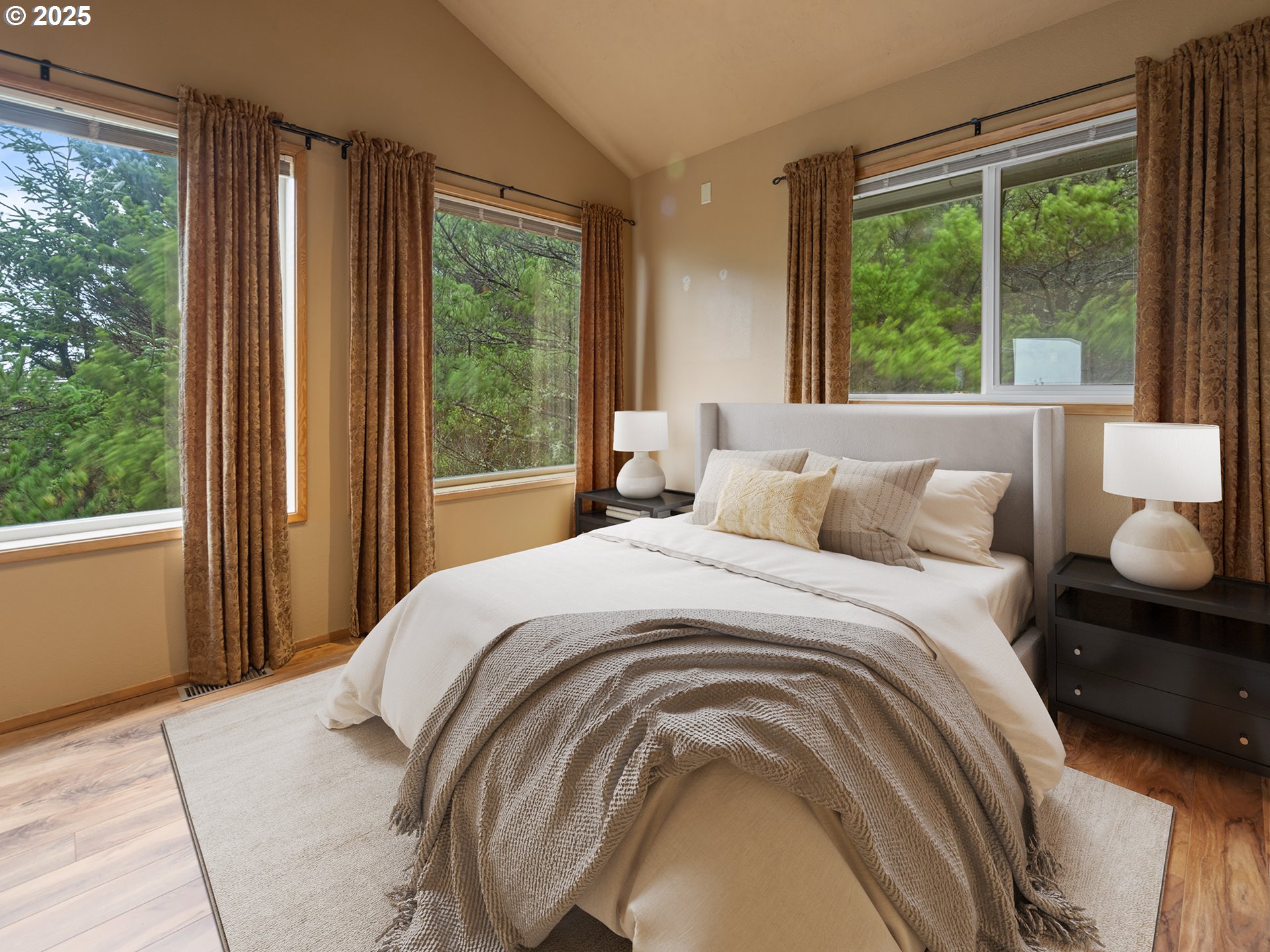 4147 Northwest Hidden Lake Loop Waldport, OR 97394 - Photo 16 of 28 a bedroom with a bed and a large window