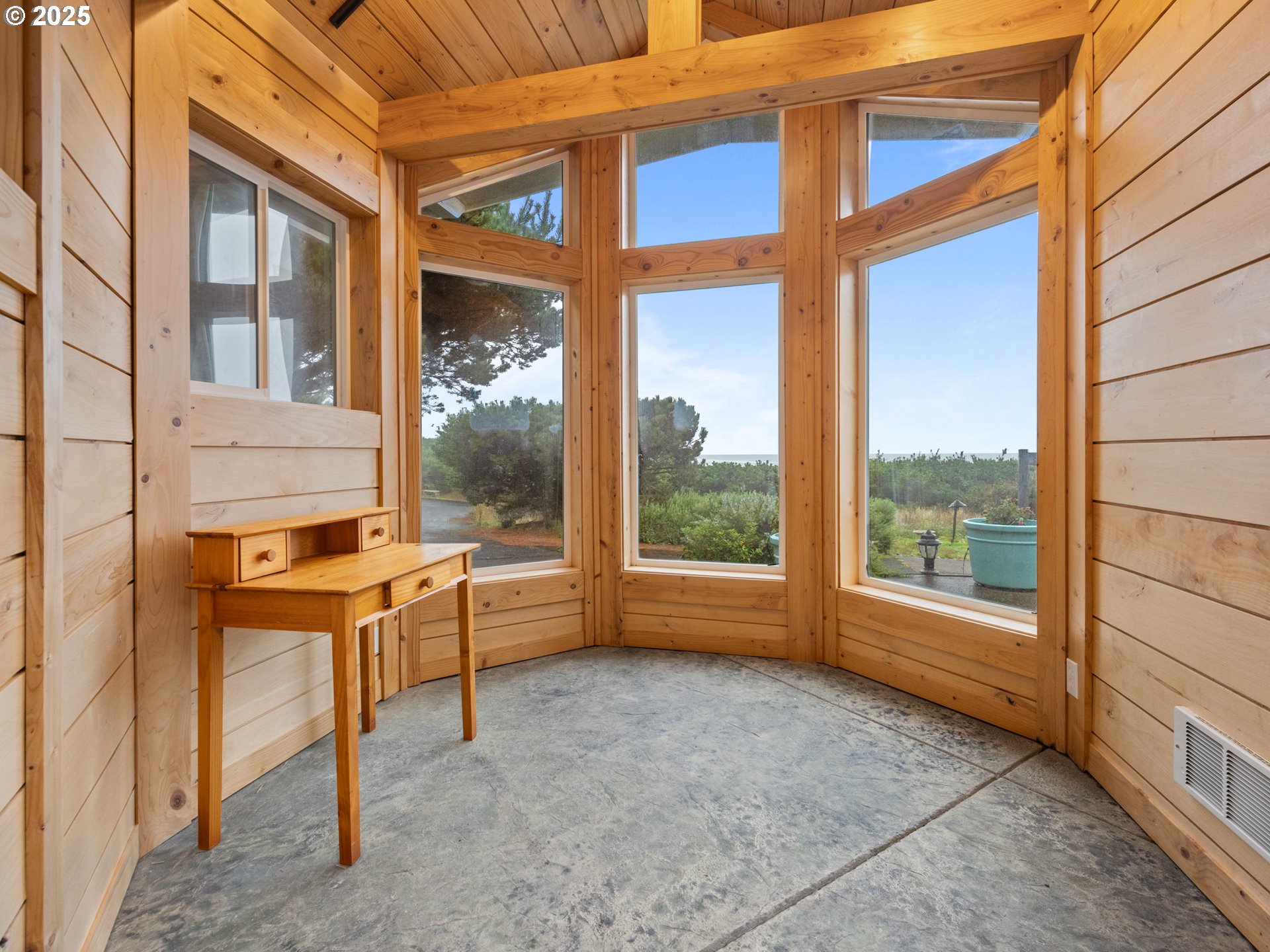 4147 Northwest Hidden Lake Loop Waldport, OR 97394 - Photo 19 of 28 a view of a room with a large window and sitting area