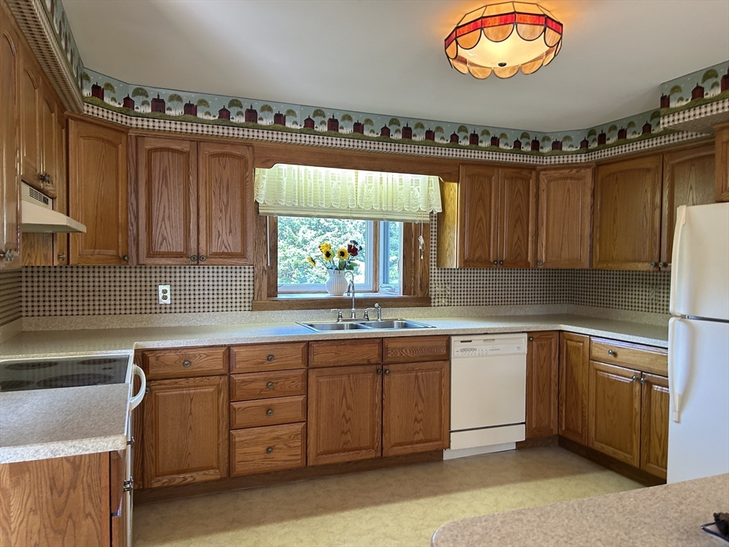 273 Main Street Acushnet, MA 02743 - Photo 15 of 37 a kitchen with a sink cabinets and window